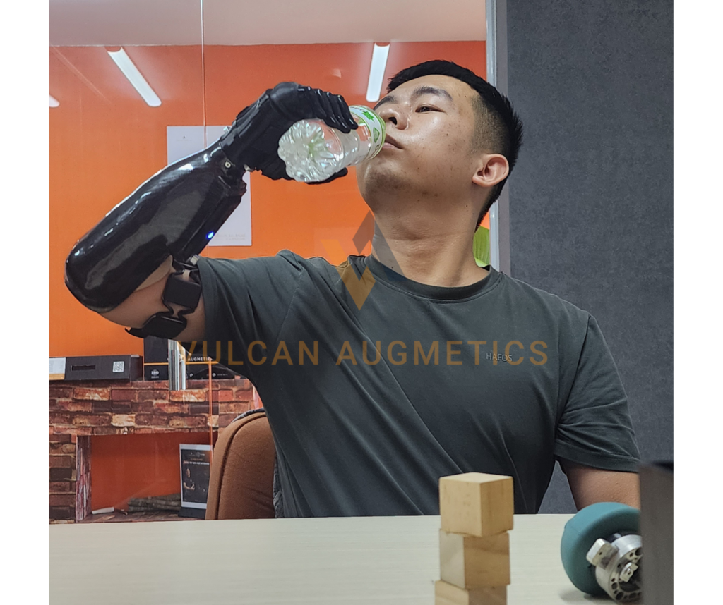 User using Vulcan Hand to hold the botttle in his daily life