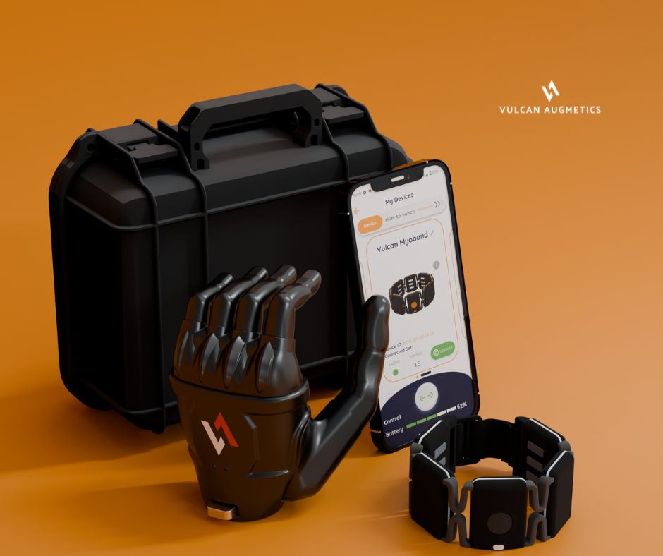 A black box with a prosthetic hand, a sensor ring and a digital phone app placed together with the orange background